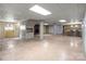 Spacious basement area with a fireplace, paneled walls, and partial view of a kitchenette at 407 Pinecroft Ln, Spencer, NC 28159