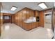 Spacious kitchen featuring wood cabinets, tile flooring, and classic design elements at 407 Pinecroft Ln, Spencer, NC 28159