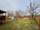 Expansive fenced backyard featuring a shed, deck, and plenty of green space at 409 Fourth St, York, SC 29745