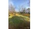 Spacious backyard with a well-maintained lawn and a wooden fence at 409 Fourth St, York, SC 29745