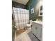Bathroom with shower and vanity, featuring neutral colors and art at 409 Fourth St, York, SC 29745
