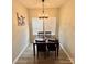 Inviting dining room with a wooden table set for four, featuring hardwood floors and neutral walls at 409 Fourth St, York, SC 29745
