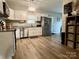 Bright kitchen with stainless steel appliances, ample cabinet space, and wood-look flooring at 409 Fourth St, York, SC 29745