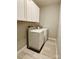 Laundry room featuring white washer and dryer with tile floors at 409 Fourth St, York, SC 29745