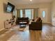 Bright living room featuring wood floors, neutral walls, and two sofas at 409 Fourth St, York, SC 29745