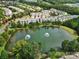 Gathering-friendly neighborhood with a tranquil pond and lush green landscaping at 44421 Oriole Dr # 203, Indian Land, SC 29707