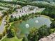 Gathering-friendly neighborhood with a tranquil pond and lush green landscaping at 44421 Oriole Dr # 203, Indian Land, SC 29707