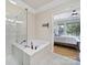 Modern bathroom with soaking tub next to glass shower at 44421 Oriole Dr # 203, Indian Land, SC 29707