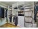 Custom closet design with built-in shelving and hanging rods at 44421 Oriole Dr # 203, Indian Land, SC 29707