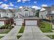 Charming home with a brick and gray exterior, featuring a two-car garage and well-maintained landscaping at 44421 Oriole Dr # 203, Indian Land, SC 29707
