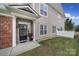 Inviting front entrance with a black door, white trim, and partial brick facade at 44421 Oriole Dr # 203, Indian Land, SC 29707