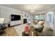Cozy living room with a fireplace, neutral tones, and comfortable seating at 44421 Oriole Dr # 203, Indian Land, SC 29707