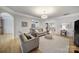 Bright living room with hardwood floors, neutral decor, and an open layout at 44421 Oriole Dr # 203, Indian Land, SC 29707