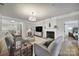 Comfortable living room features a fireplace, hardwood floors, and neutral decor at 44421 Oriole Dr # 203, Indian Land, SC 29707