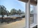 Lake view from a window with blue sky and trees at 44421 Oriole Dr # 203, Indian Land, SC 29707