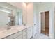 Bathroom featuring double sinks, white cabinets, quartz counters, and a glass enclosed shower at 4465 Dusty Orchard Rd, Kannapolis, NC 28081