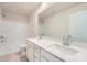 Bathroom with double sinks, large mirror, white cabinets, and a shower-tub combo at 4465 Dusty Orchard Rd, Kannapolis, NC 28081