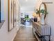 Inviting foyer with wood floors, stylish decor, and a glimpse into the open-concept living and dining areas at 4465 Dusty Orchard Rd, Kannapolis, NC 28081