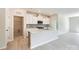 Modern kitchen with white cabinets, quartz countertops, stainless appliances, and gray subway tile backsplash at 4465 Dusty Orchard Rd, Kannapolis, NC 28081