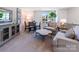 Comfortable sitting room with plush seating, natural light, and a view of the neighborhood at 4465 Dusty Orchard Rd, Kannapolis, NC 28081