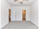 Neutral bedroom featuring carpet, a ceiling fan, and an ensuite bathroom at 5609 Morgan Mill Rd, Monroe, NC 28110