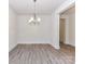 Minimalist dining space with modern chandelier and natural light at 5609 Morgan Mill Rd, Monroe, NC 28110