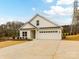 New construction with a two car garage, modern farmhouse design, and covered front porch at 5609 Morgan Mill Rd, Monroe, NC 28110