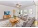Bright living room with neutral tones, ceiling fan, stylish furniture, and plenty of natural light at 5609 Morgan Mill Rd, Monroe, NC 28110