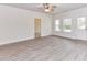 Neutral living space with view to backyard, light floors, and white door at 5609 Morgan Mill Rd, Monroe, NC 28110