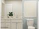 Well-lit bathroom with double vanity, modern fixtures, and stylish design at 5710 Olive Beach Rd, Kannapolis, NC 28081
