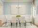 Stylish dining room with a white oval table, modern chairs, and elegant decor at 5710 Olive Beach Rd, Kannapolis, NC 28081