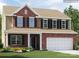 New construction two-story home with brick facade, 2-car garage, and manicured lawn at 5710 Olive Beach Rd, Kannapolis, NC 28081