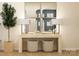 Contemporary entryway features console table with baskets, lamps, and an olive tree at 5710 Olive Beach Rd, Kannapolis, NC 28081