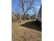 Large backyard with mature trees and a shed, offering plenty of space for outdoor enjoyment at 5949 Flat Creek Rd, Kershaw, SC 29067