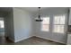 Bright dining area with stylish lighting and a view of the backyard, ideal for Gathering meals at 5949 Flat Creek Rd, Kershaw, SC 29067