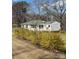Charming one-story home with blooming bushes and a well-maintained lawn, offering great curb appeal at 5949 Flat Creek Rd, Kershaw, SC 29067