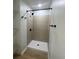 Modern bathroom with a tiled walk-in shower and sleek, black fixtures at 5949 Flat Creek Rd, Kershaw, SC 29067