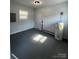 Utility room featuring gray flooring and a hot water heater at 5949 Flat Creek Rd, Kershaw, SC 29067