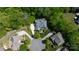 Stunning aerial view of a home with lush landscaping and a private driveway nestled among mature trees at 653 Buckleigh Nw Ct, Concord, NC 28027