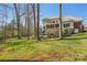 Expansive backyard with mature trees and lush green grass provides ample space at 653 Buckleigh Nw Ct, Concord, NC 28027