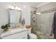 Bright bathroom features a glass shower, granite countertop, tile floors, and stylish vanity at 653 Buckleigh Nw Ct, Concord, NC 28027