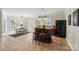Open kitchen boasts a large island, bar seating, stainless steel refrigerator, and adjacent breakfast nook at 653 Buckleigh Nw Ct, Concord, NC 28027