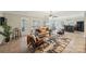 Open-concept living room with tile flooring, a ceiling fan, large windows, and modern decor at 653 Buckleigh Nw Ct, Concord, NC 28027