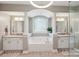 Bright main bathroom with dual vanities, a soaking tub, and plenty of natural light for relaxation at 653 Buckleigh Nw Ct, Concord, NC 28027