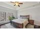 Serene main bedroom with a large window and decorative ceiling detail creating a peaceful retreat at 653 Buckleigh Nw Ct, Concord, NC 28027