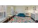Cozy playroom with a colorful rug, neutral walls, and natural light at 653 Buckleigh Nw Ct, Concord, NC 28027