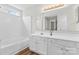 Bathroom featuring a white vanity, a large mirror and tub and shower at 7047 Whittingham Dr, Indian Land, SC 29707