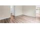 Neutral bedroom featuring light gray walls, vinyl floors, a closet, and a view of the en suite bathroom at 7047 Whittingham Dr, Indian Land, SC 29707