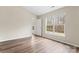 Bright bedroom with wood-look floors and a large window offering lots of natural light at 7047 Whittingham Dr, Indian Land, SC 29707
