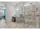 Bathroom features double sink vanity, a glass enclosed shower, vanity area and natural light at 7118 Overjoyed Xing, Charlotte, NC 28215